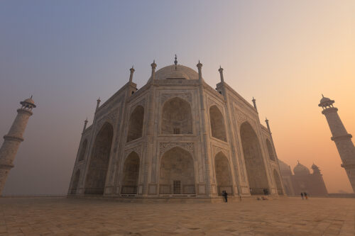 Taj Mahal Minarets. Taj Mahal at sunrise, Agra, Uttar Pradesh, India. Although it doesn't look like it from this wide angle photograph, the four minarets (towers) surrounding the Taj Mahal were constructed farther away from the main structure than usual. The minarets lean slightly outward as a safety measure so that if any of them fell, they would fall away from the tomb rather than damage the central structure.