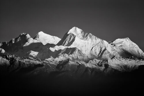 Telephoto view of some of the worlds highest mountains; Lhotse (8516 m), Mt Everest (8848 m), Makalu (8485 m) and Chomo Lonzo (7540 m). Sandakphu, West Bengal, India.