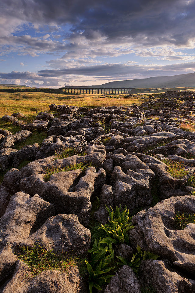 The Ribblehead Viaduct otherwise known as Batty Moss Viaduct is part of the Settle-Carlisle railway across Batty Moss at Ribblehead, North Yorkshire. The viaduct was built by the Midland Railway between 1870 and 1874 is a Grade II* listed structure. In the land surrounding the viaduct the remains of the construction camps and navvy settlements can still be seen.